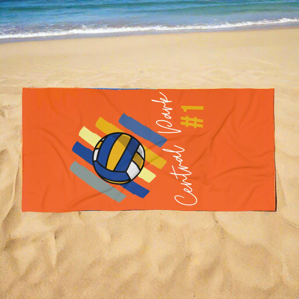 Orange Central Park #1 volleyball beach towel laid flat on black background
