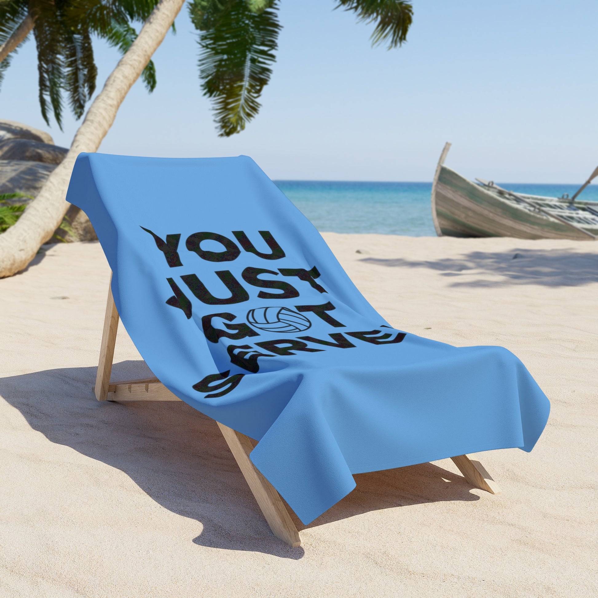 Volleyball player relaxing on a You Just Got Served towel.
