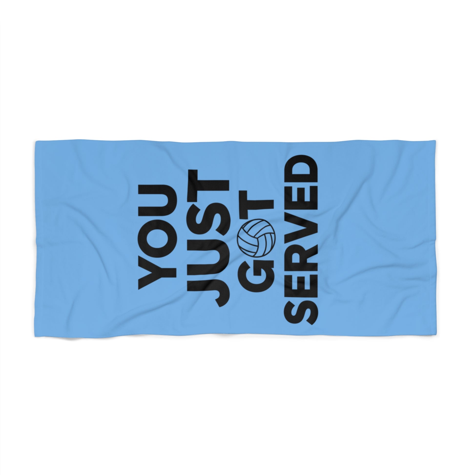 You Just Got Served volleyball towel displayed on sandy beach.