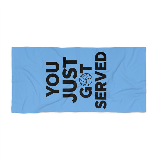 You Just Got Served volleyball towel displayed on sandy beach.