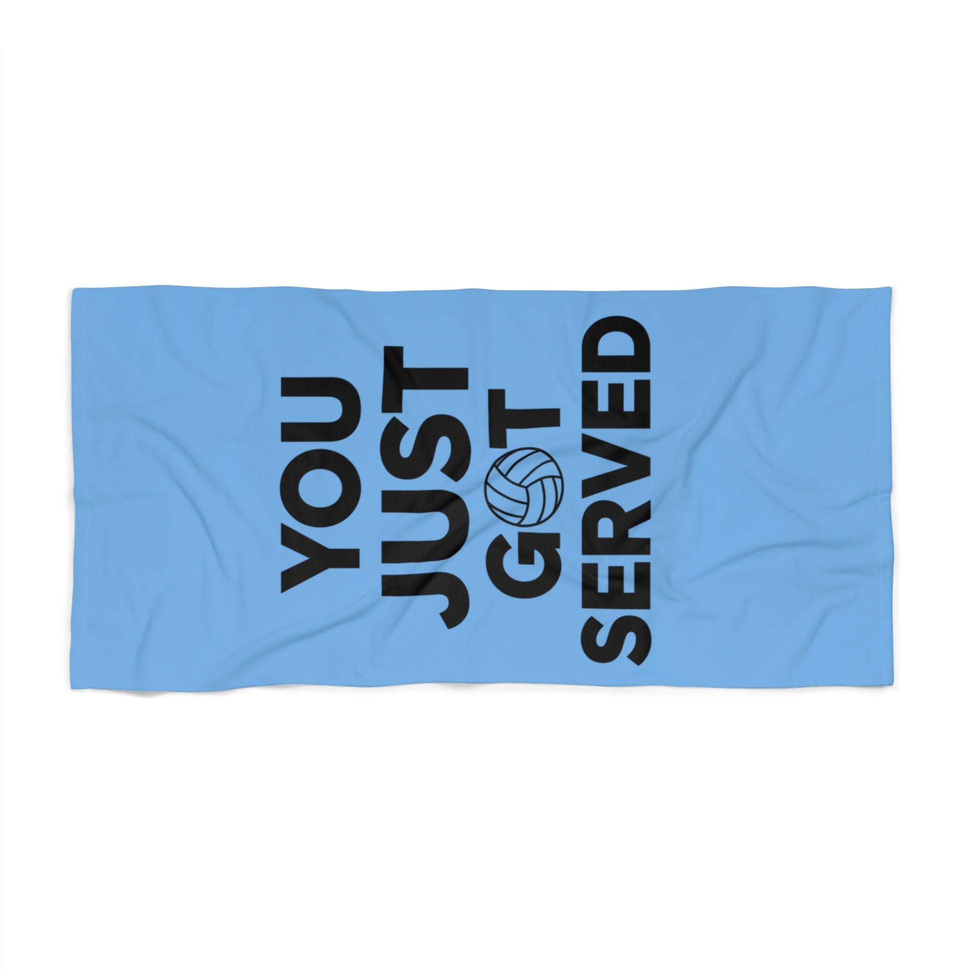 Volleyball-themed beach towel with bold text design.