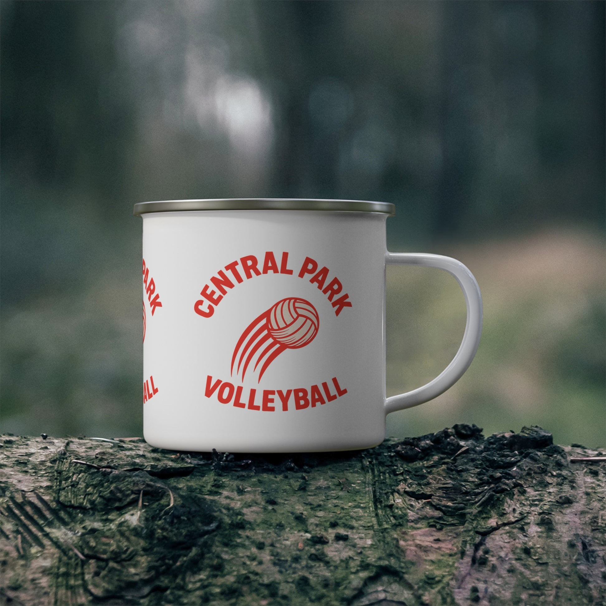 Volleyball fire enamel mug displayed with camping gear