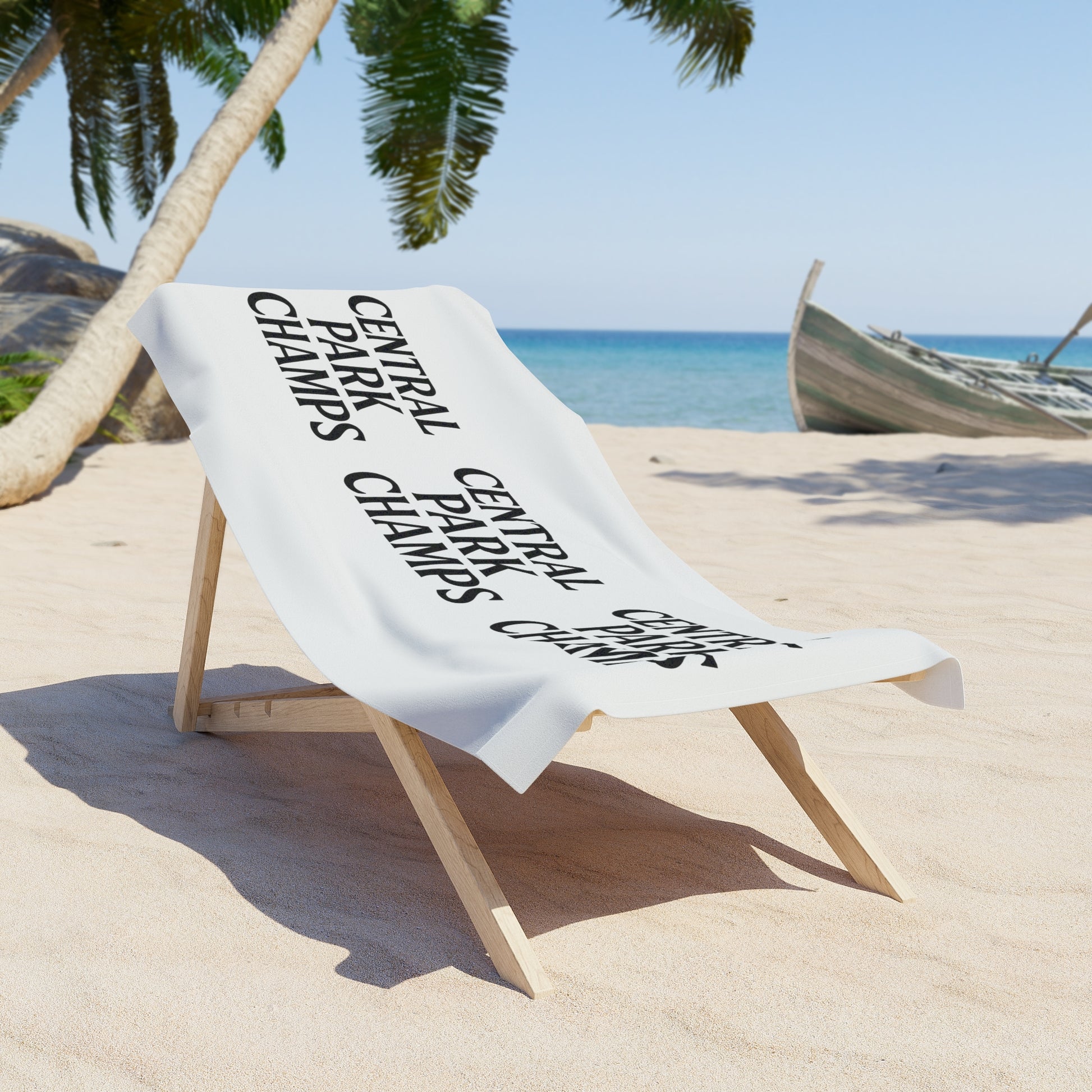 Close-up of Champs print on bright beach towel.