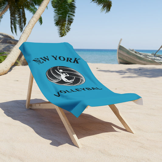 Beach towel featuring volleyball player spiking graphic.