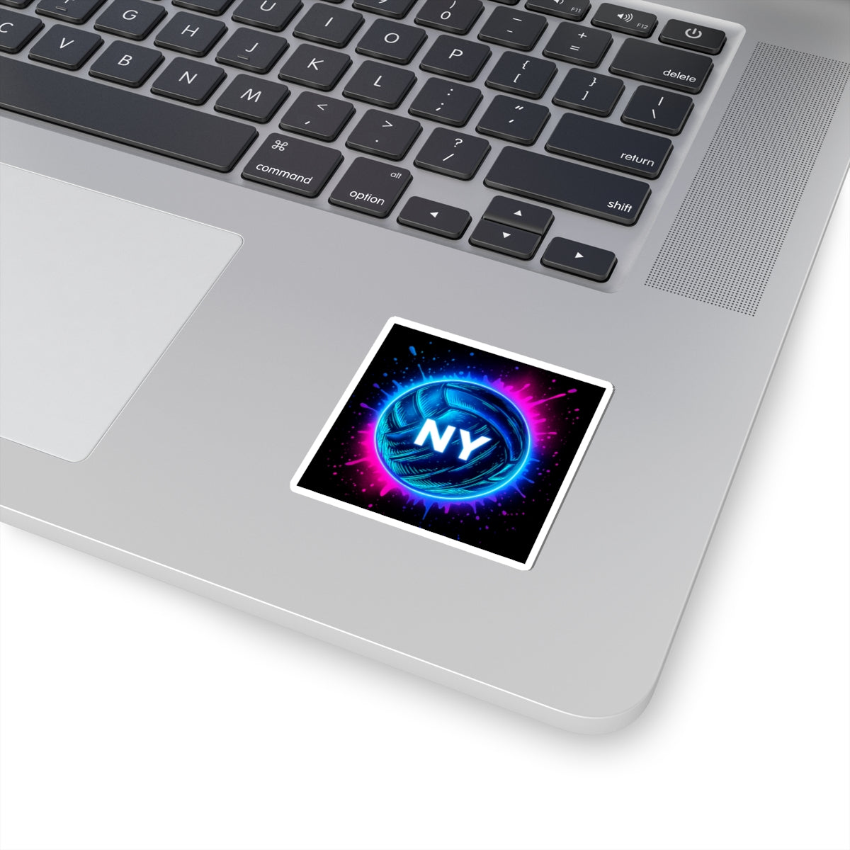 Close-up of beach volleyball sticker on laptop
